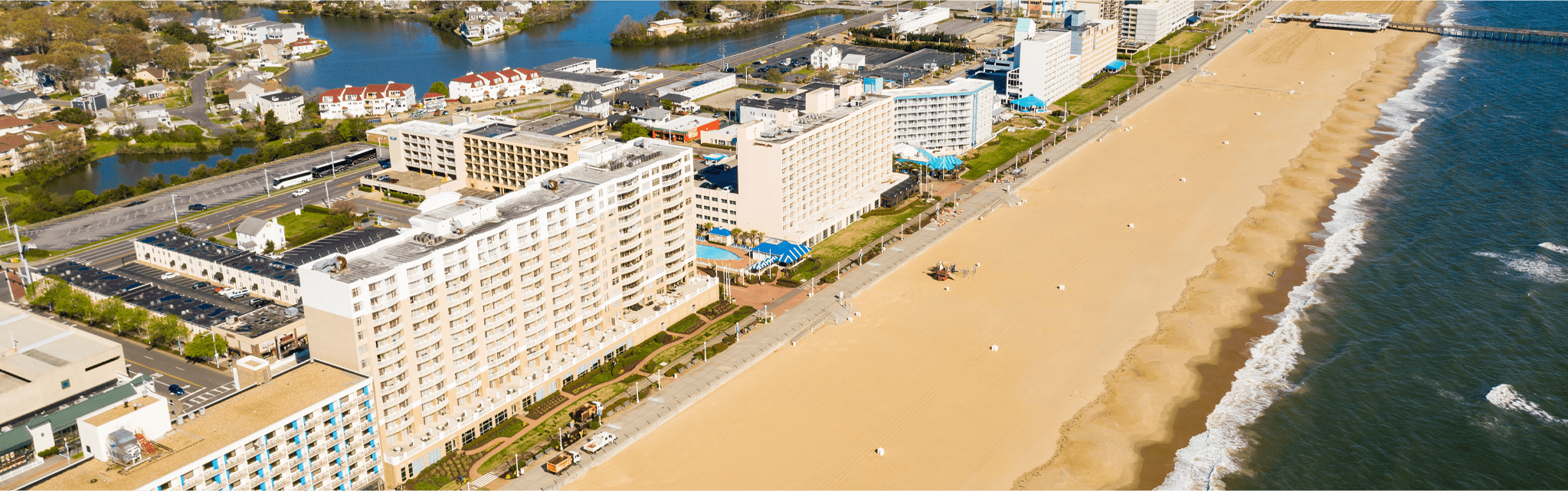 an aerial view of the beach and hotels