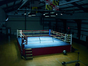 an empty boxing ring in a gym